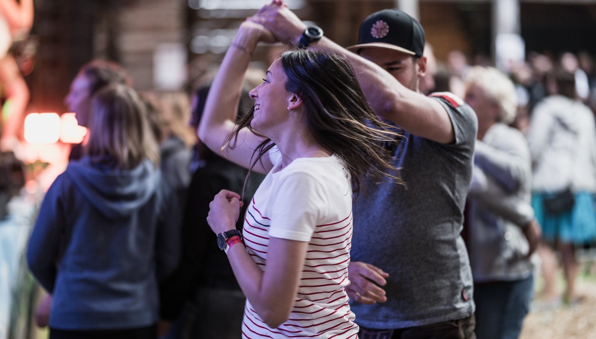 The image shows a young couple dancing.