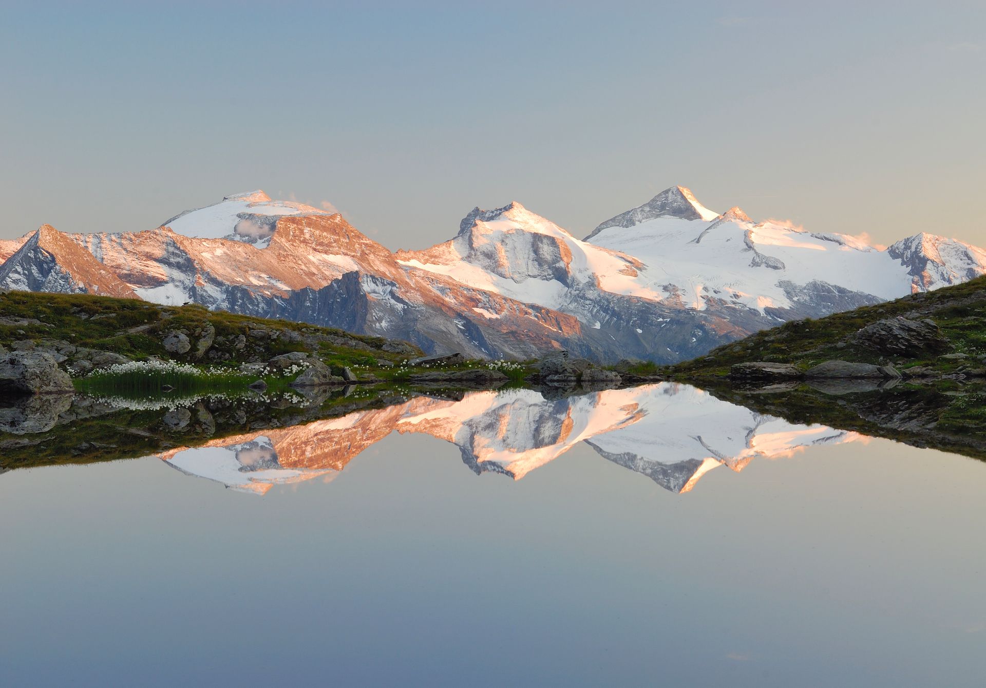 Mountain lake in the Zillertal with snowy mountains in the background
