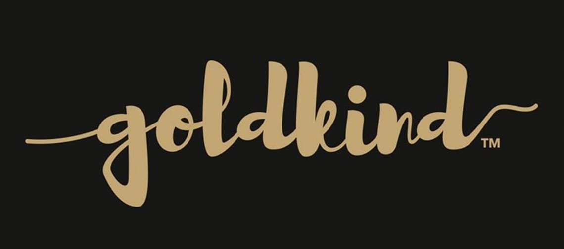 The logo of Goldkind has a black background with golden, flowing script that looks elegant and sophisticated.