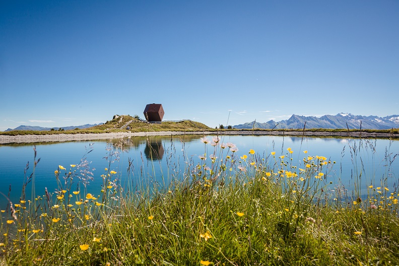 The image shows the Granatalm at Penkenjoch with a reservoir lake in the foreground.