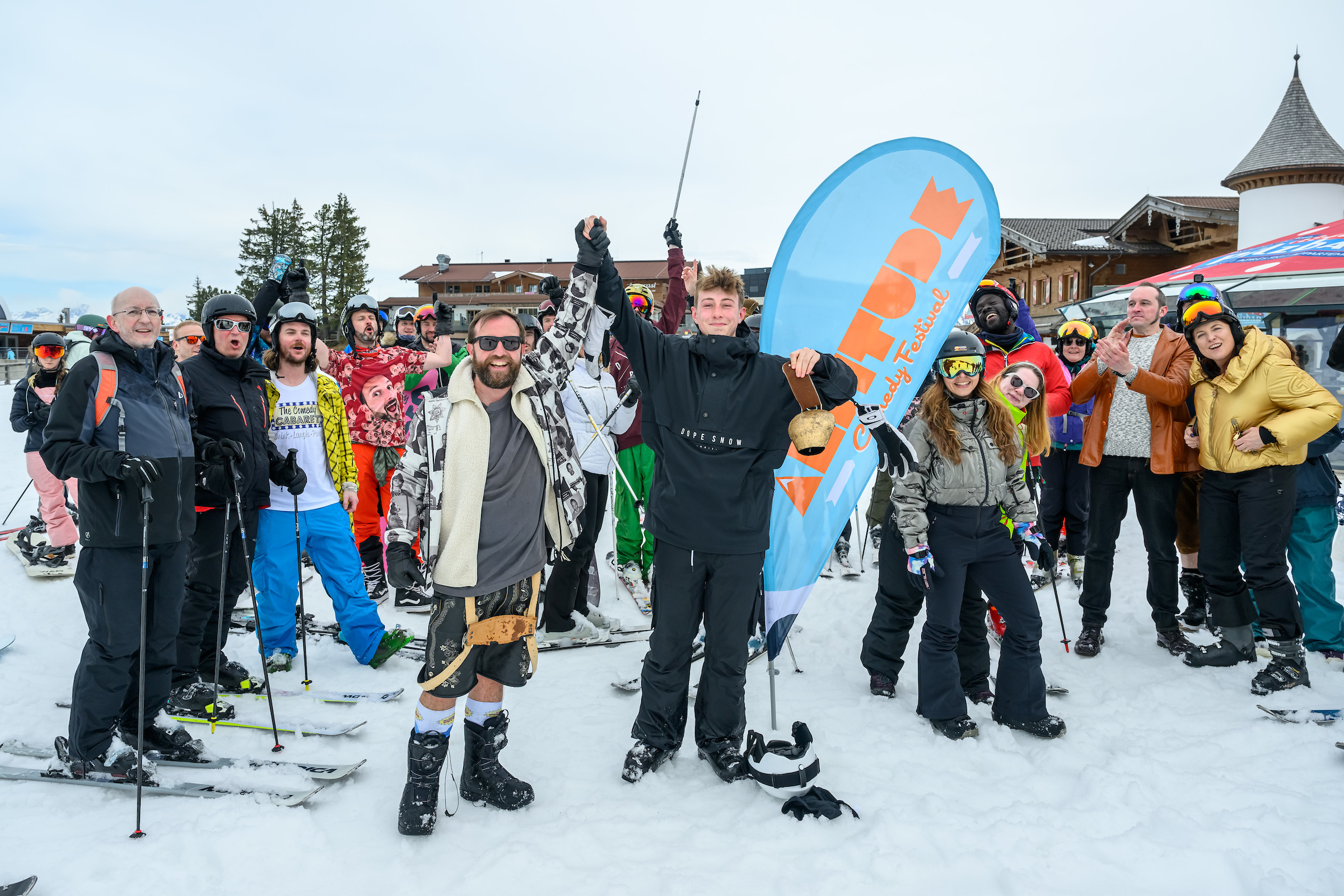 People are standing on the slope on the mountain.