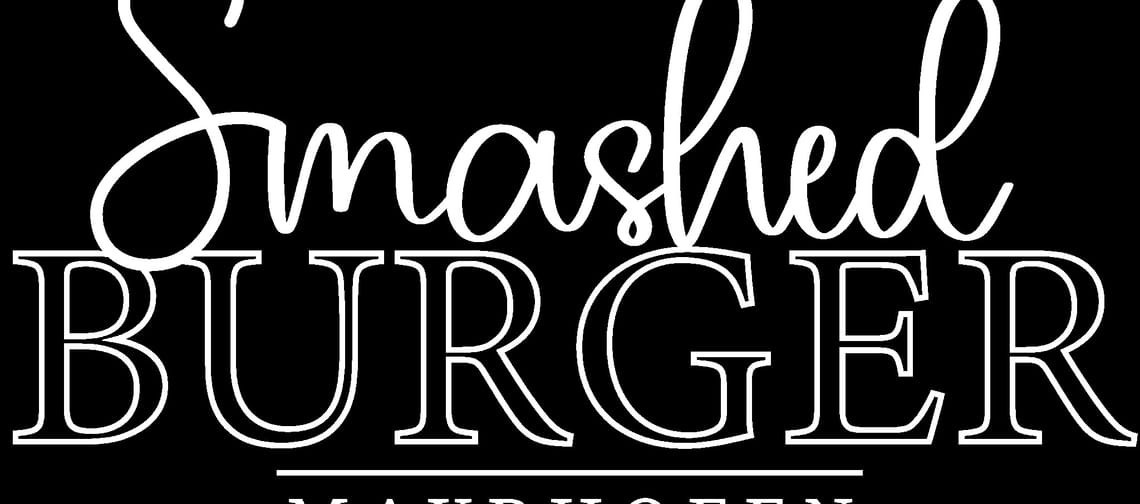 The image shows the logo of Smashed Burger Mayrhofen in white lettering on a black background.
