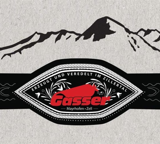 Black band with Gasser logo, mountain silhouette in the background, stylized and elegant design.