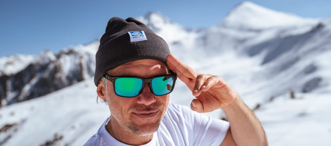 Man stands on the mountain wearing the PenkenPark Beanie