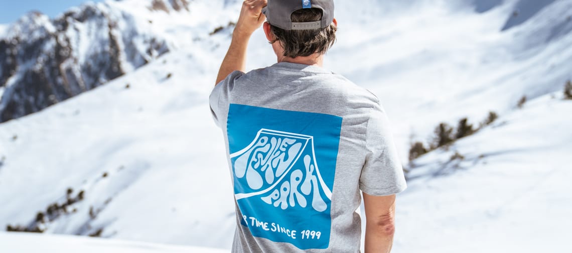 Man standing on the mountain wearing a PenkenPark shirt