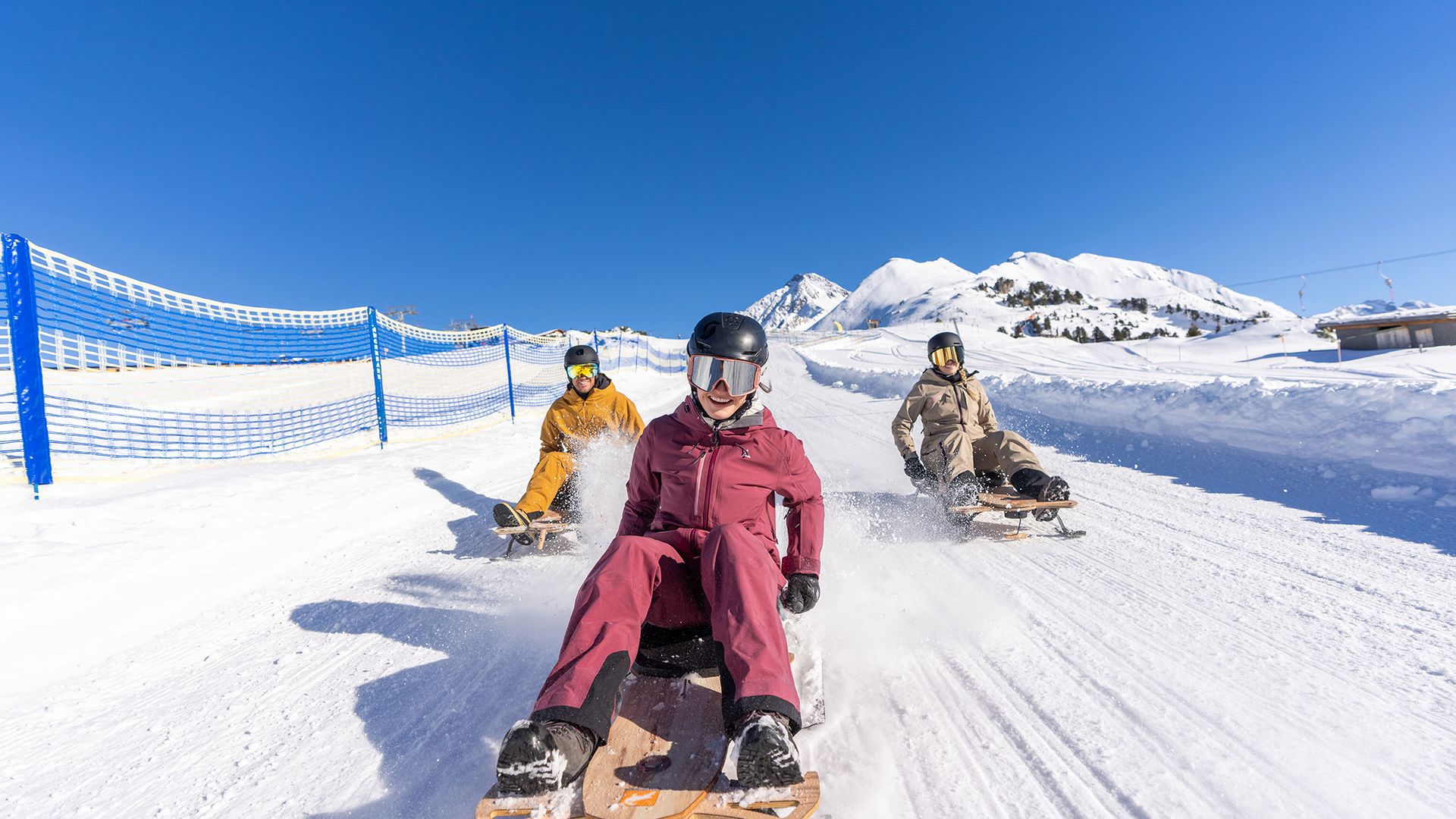 Friends riding the PistenBock at Mount Ahorn in Mayrhofen