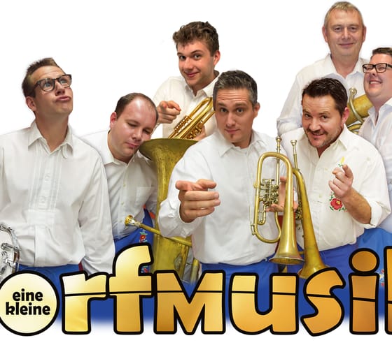 Group of eight men with musical instruments, wearing white shirts, smiling or making funny faces.