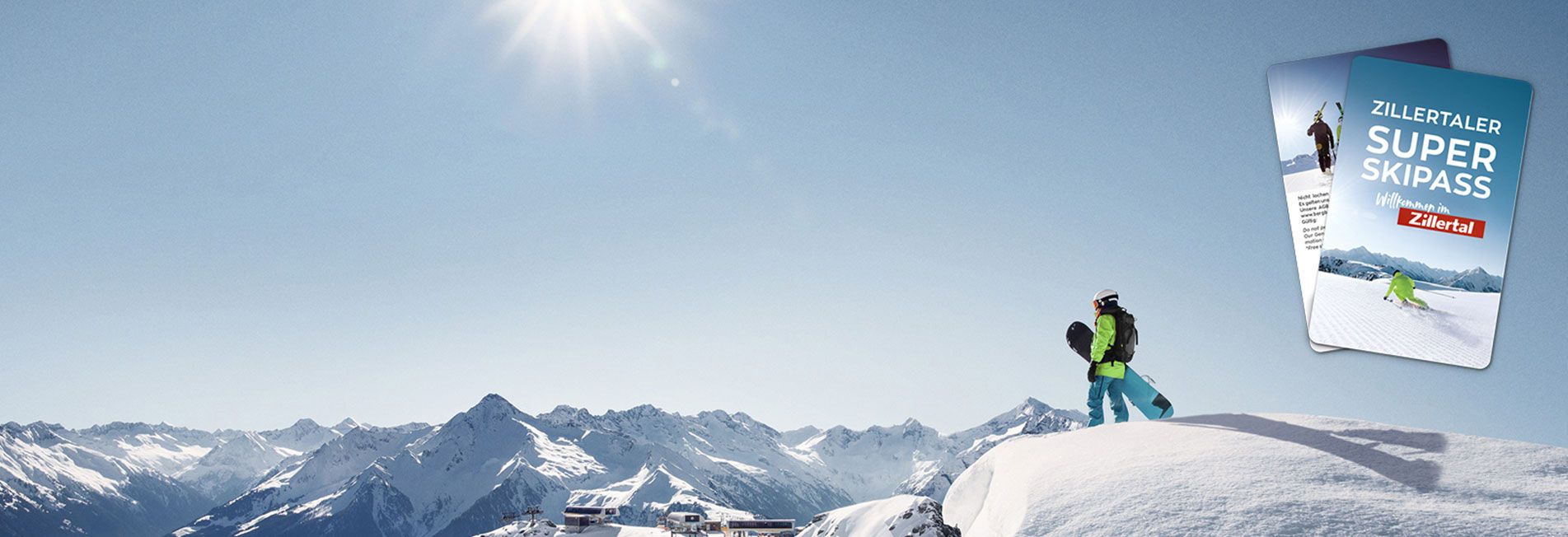 Skier on snow-covered mountain with mountain range in background, sunlight, and two brochures on the right.