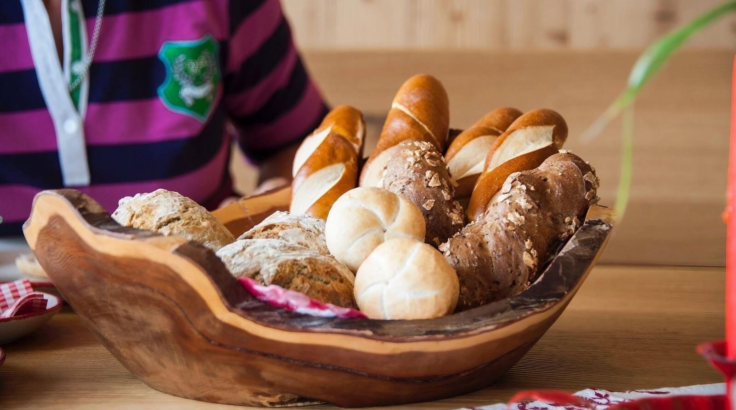 A bread basket filled with assorted pastries