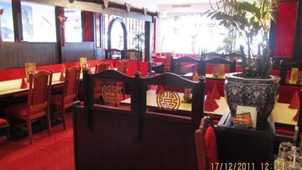 The picture shows the interior of the China Restaurant, designed in a traditional Chinese style. The space is predominantly red, with classic decorations that create a warm and culturally authentic atmosphere.