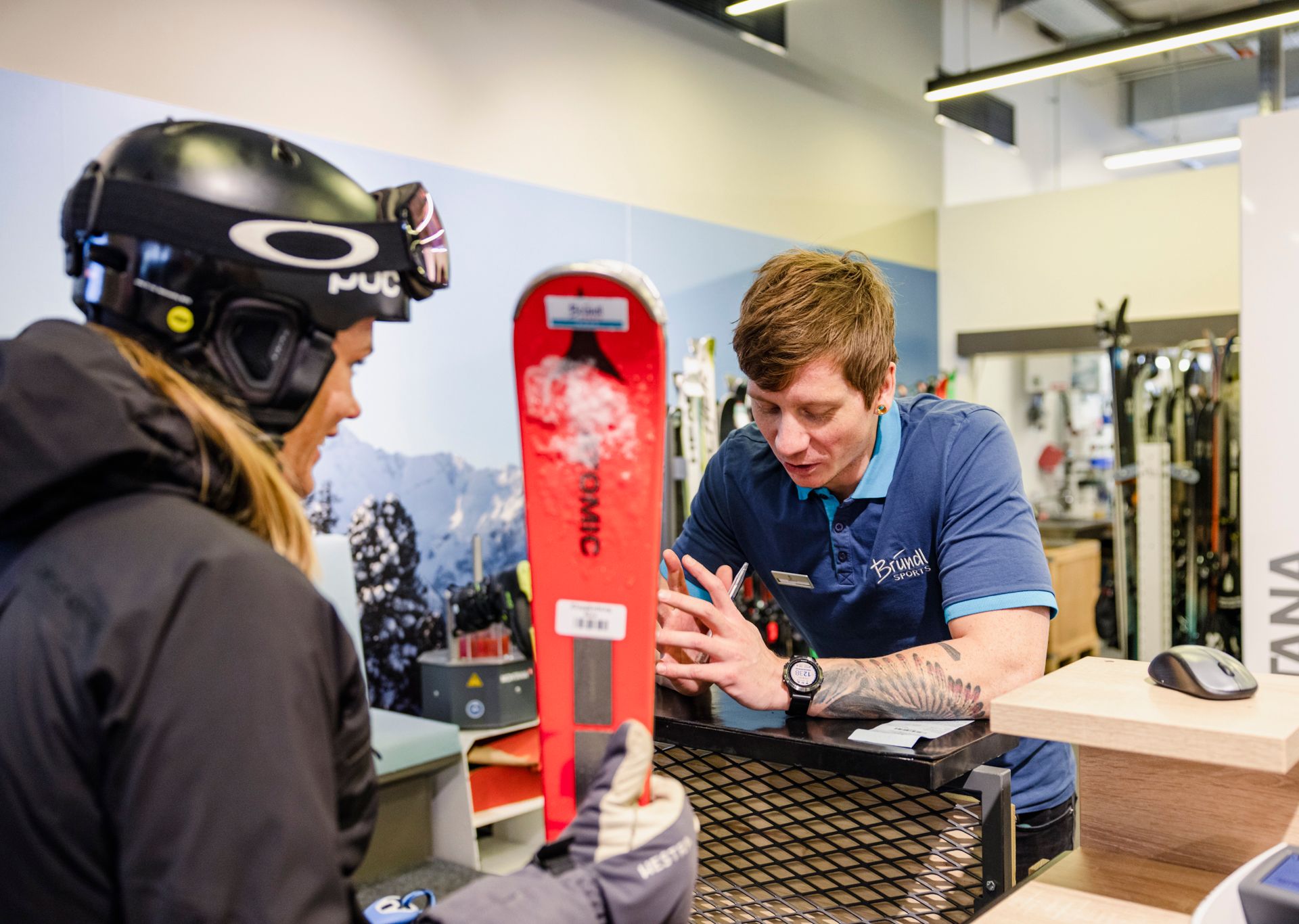 Woman and man in the ski rental at Bründl Sports in Mayrhofen