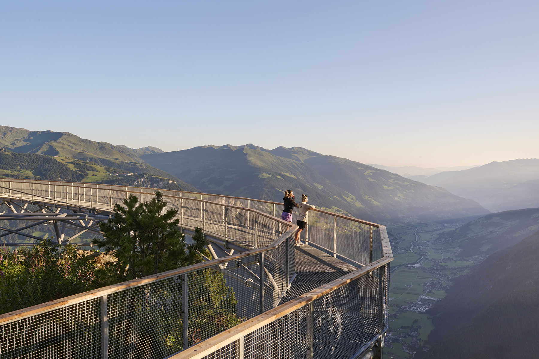 View of Mayrhofen and the Zillertal at sunrise from the GreifenBrücke bridge