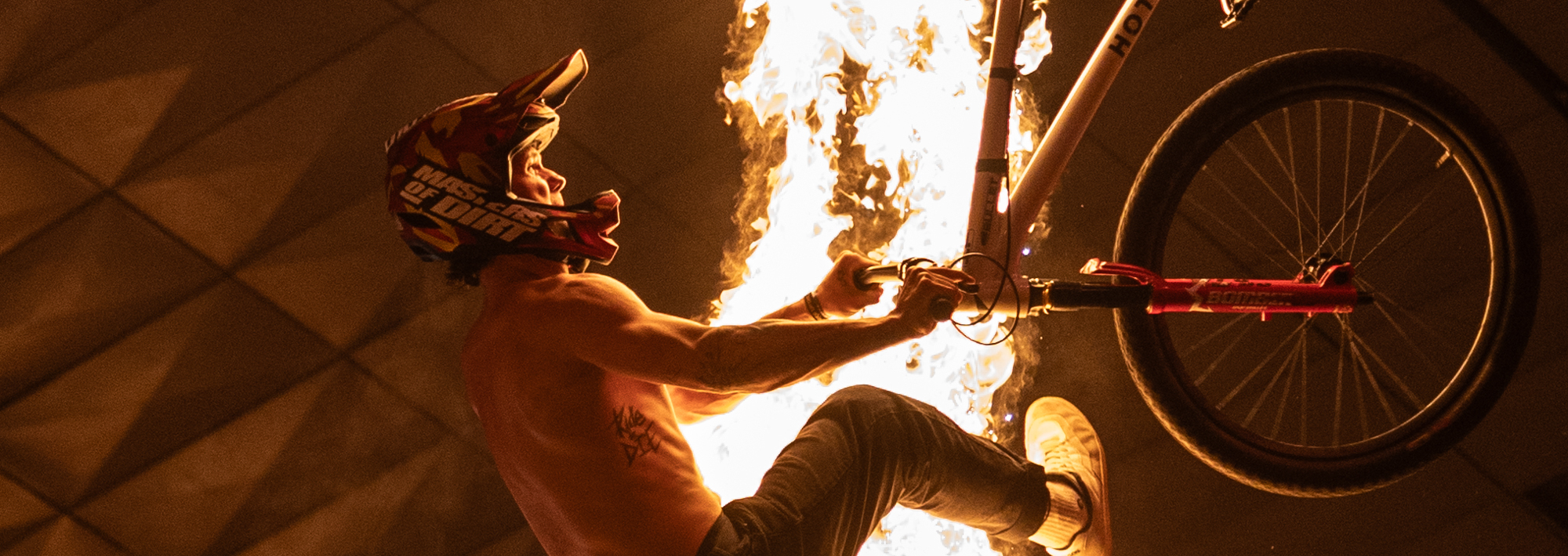 Motorcyclist with a fire background