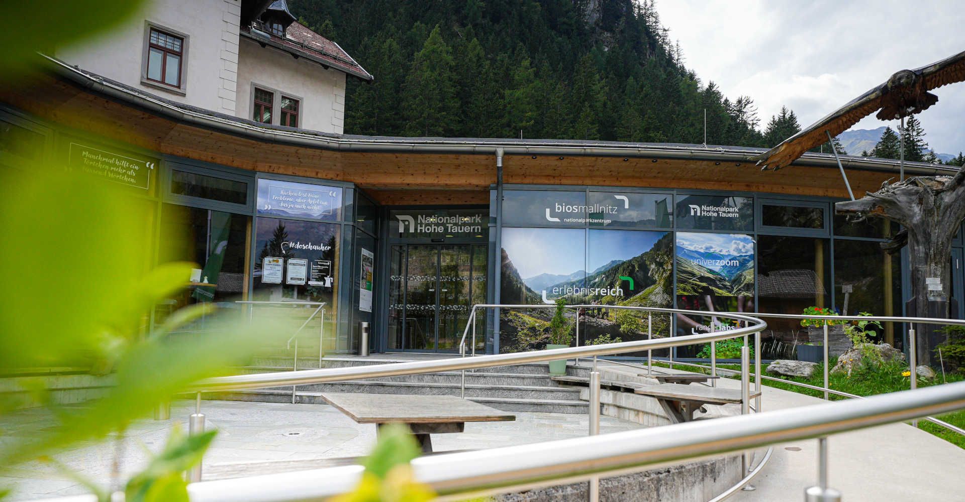 BIOS Mallnitz National Park Center in the Hohe Tauern National Park, featuring a modern lobby and barrier-free access, nestled in the heart of the Alpine mountain landscape.