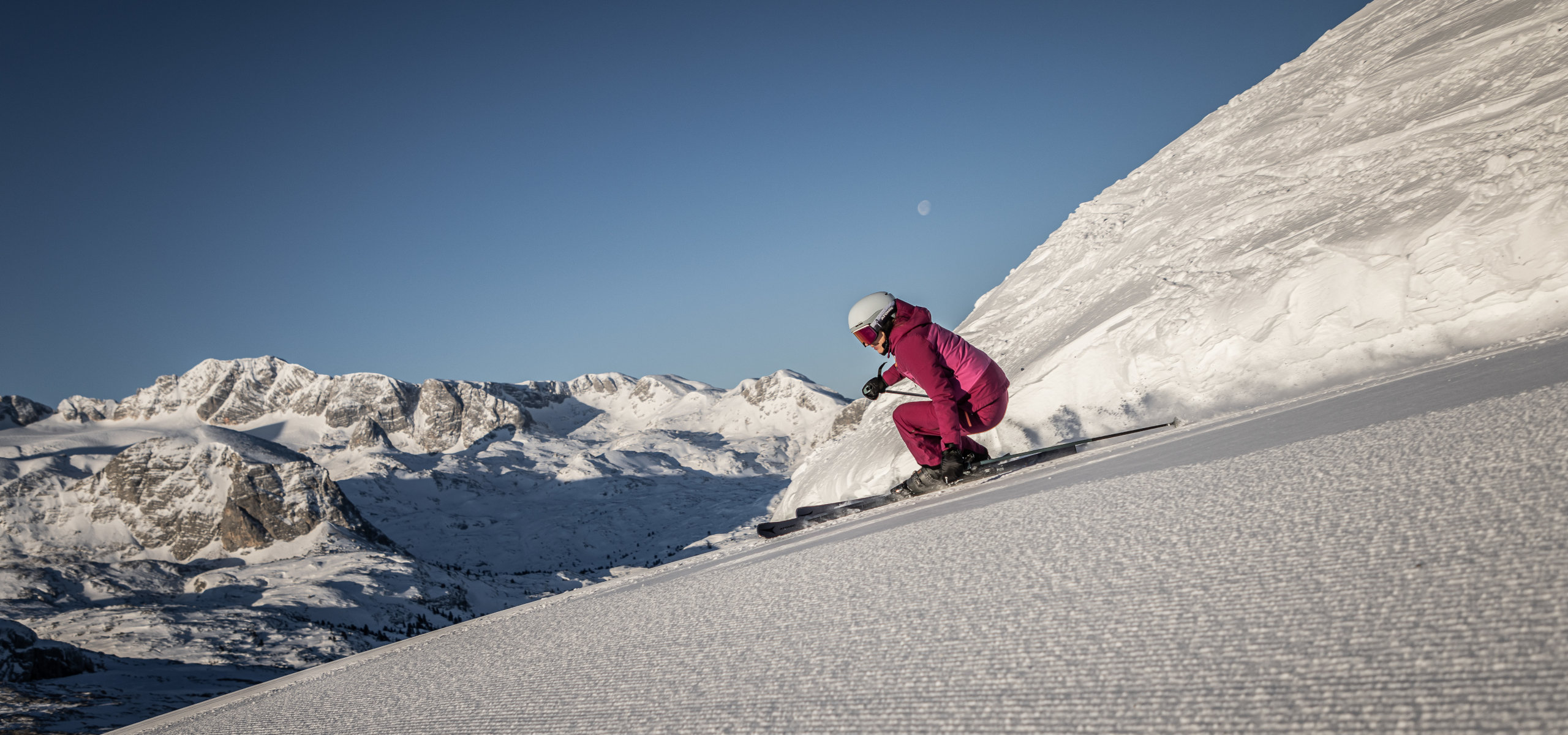 Skiing at Dachstein Krippenstein with a view of the snow-covered Alpine landscape.