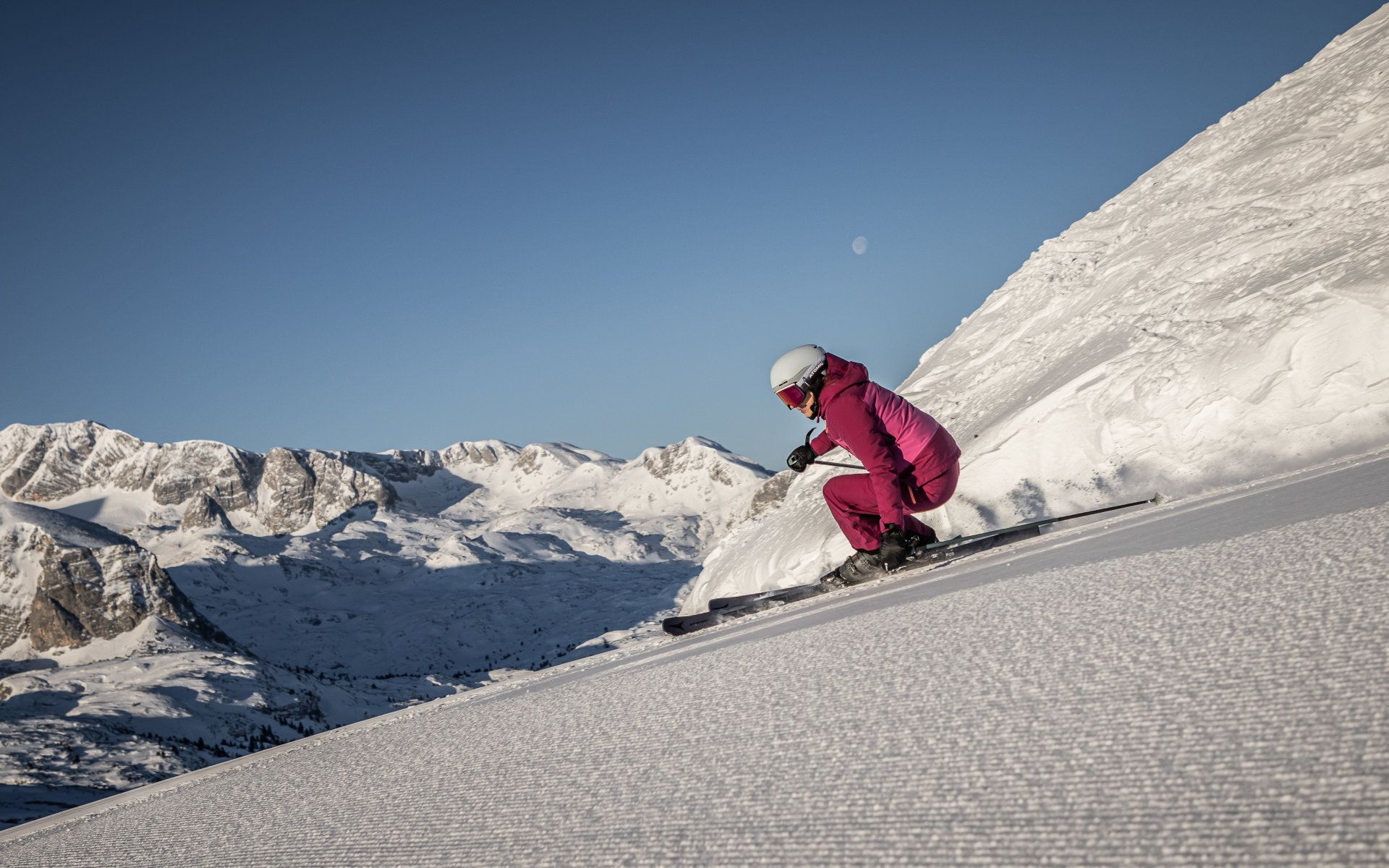 Skiing at Dachstein Krippenstein with a view of the snow-covered Alpine landscape.