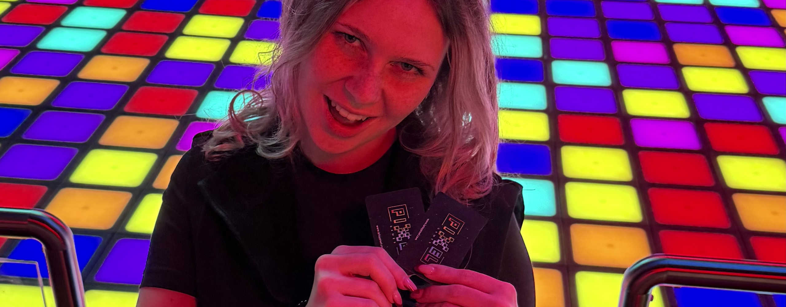 A person is holding cards in their hand 