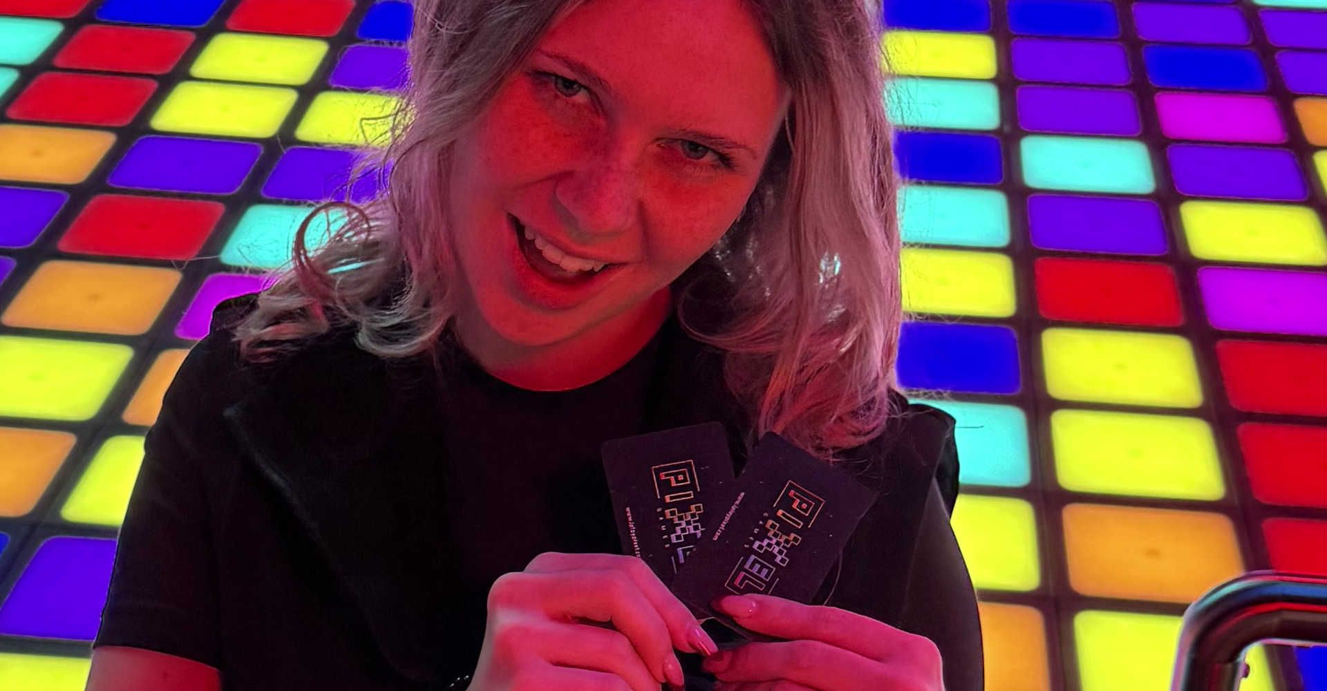 A person is holding cards in their hand