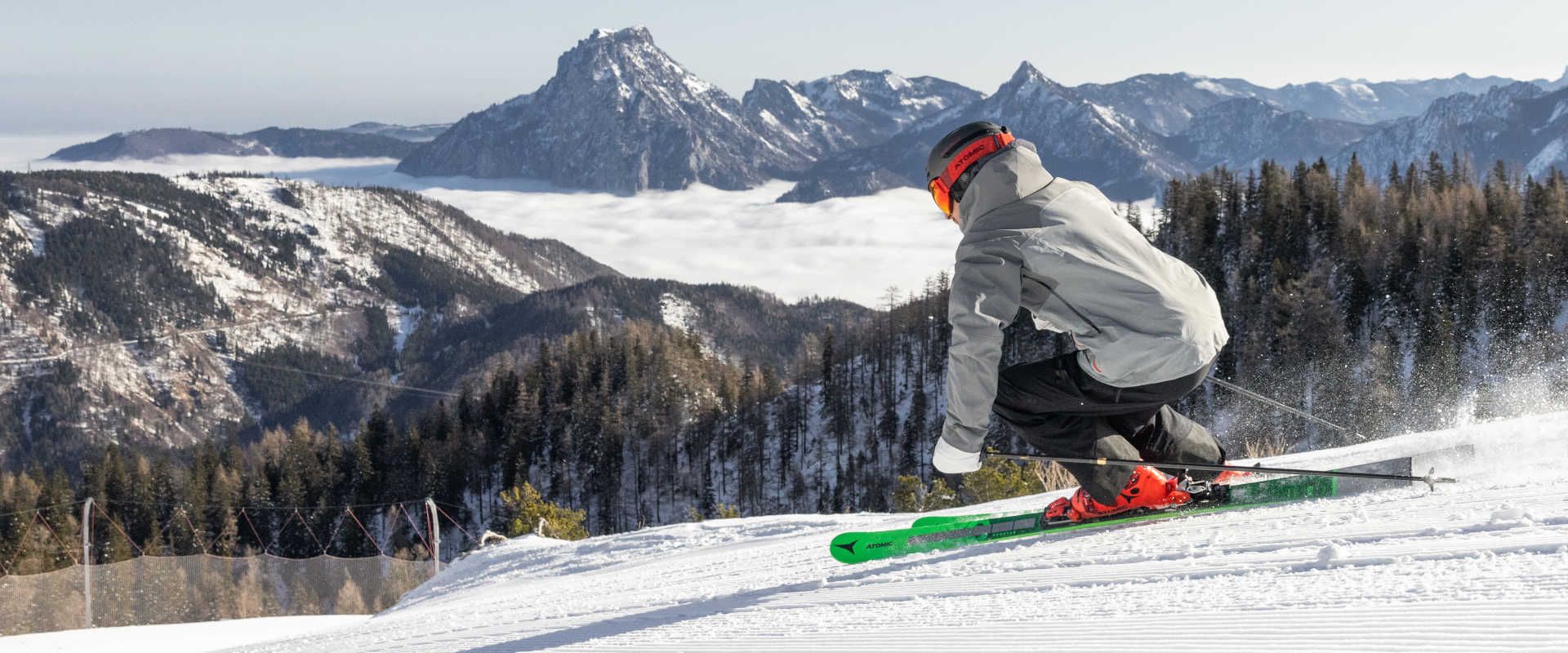 Skiing at Feuerkogel, surrounded by snow-capped mountains and an impressive Alpine panorama.