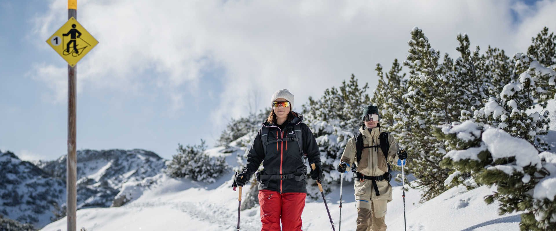 Snowshoeing on the Feuerkogel along a snow-covered trail in a wintry Alpine landscape.