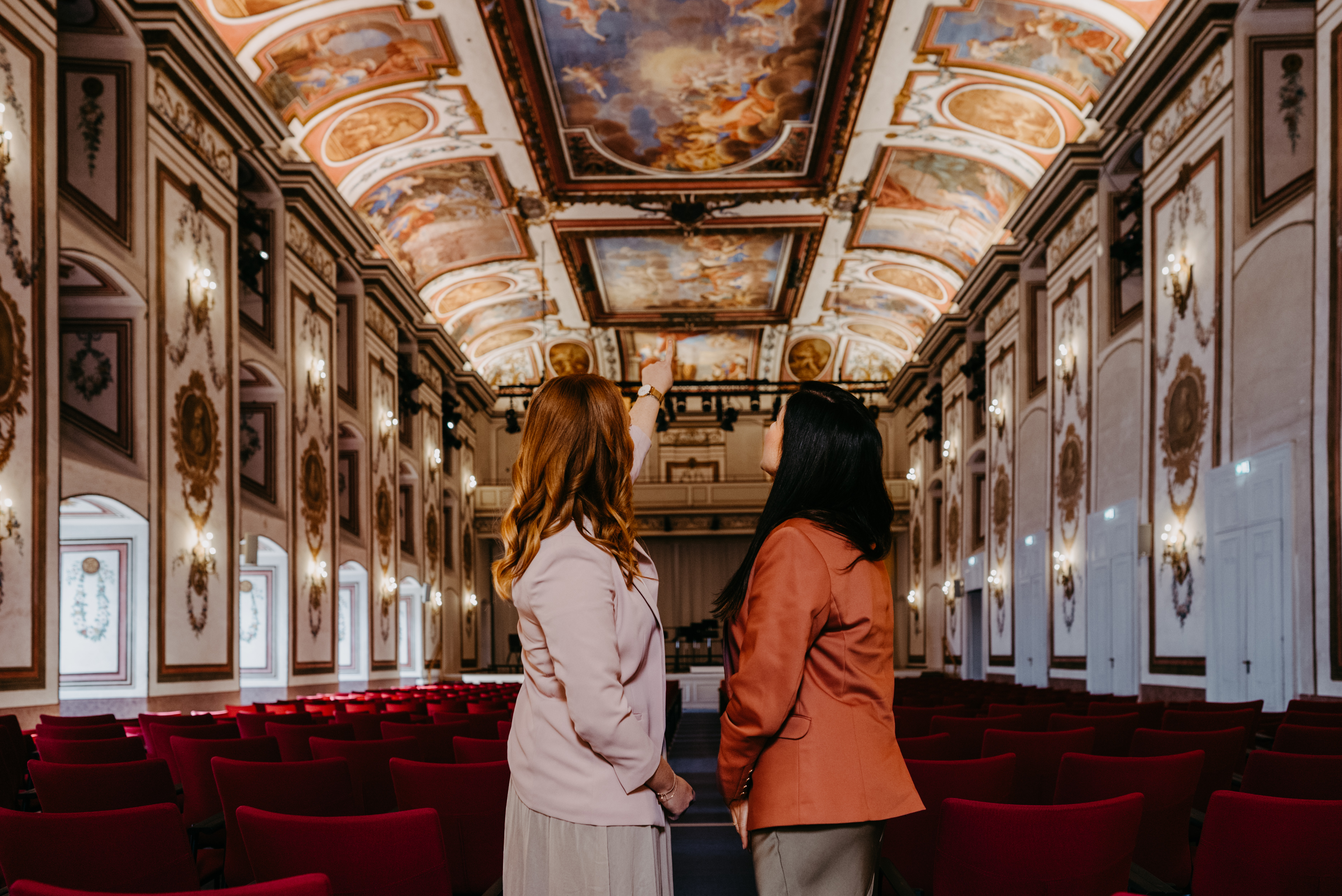 2 women on a guided tour of the hall