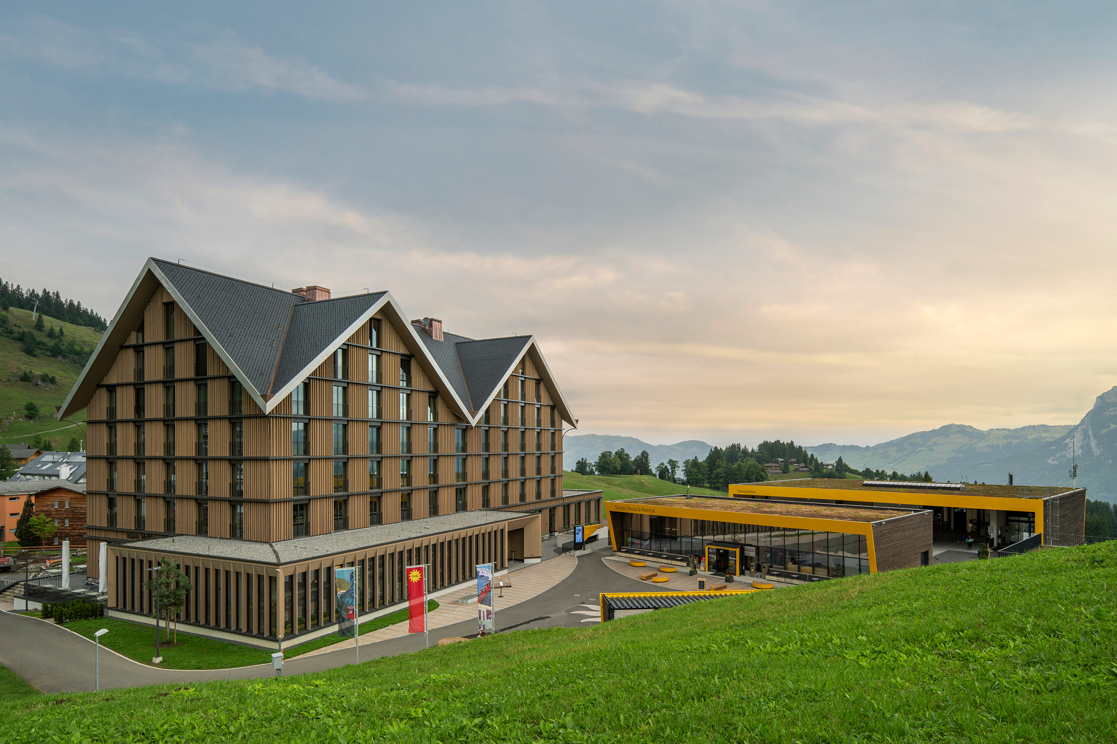 Hotel on Stoos next to the mountain station with modern architecture in an alpine setting.