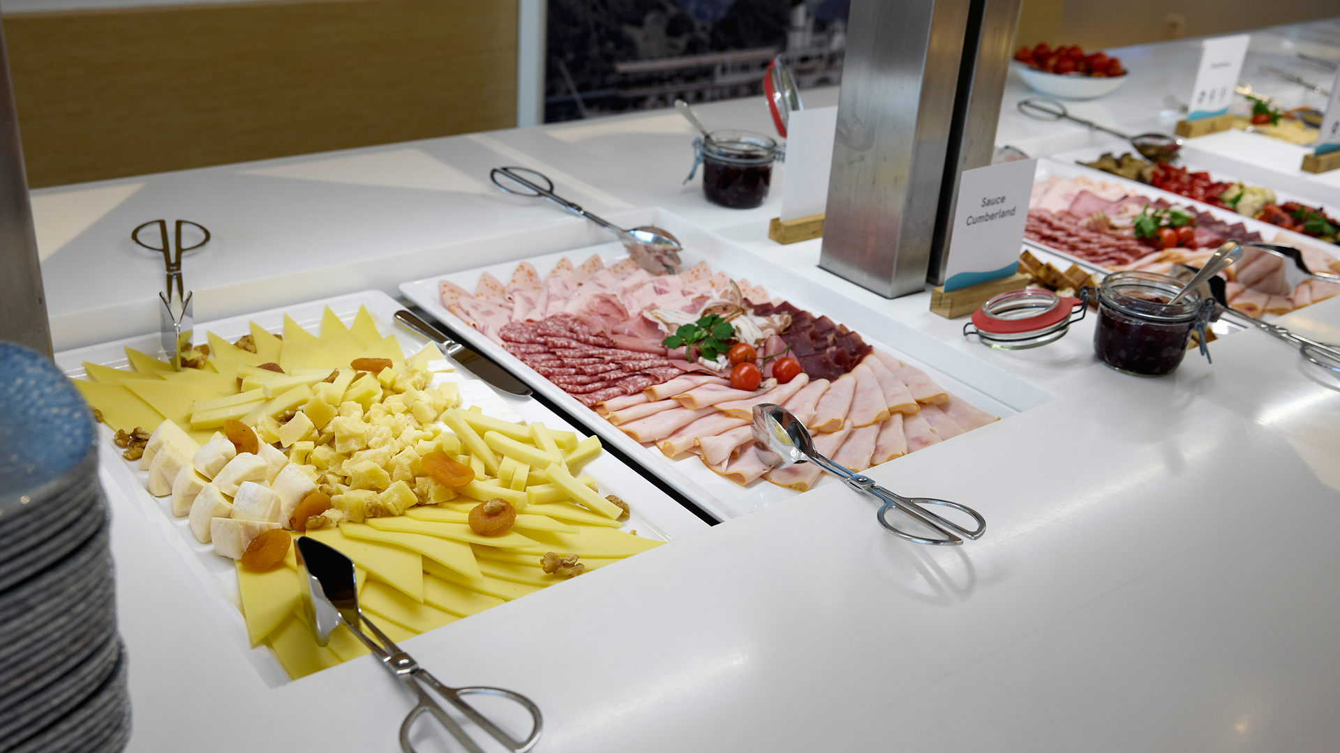 Breakfast buffet with cheese and meat specialties on board a ship.