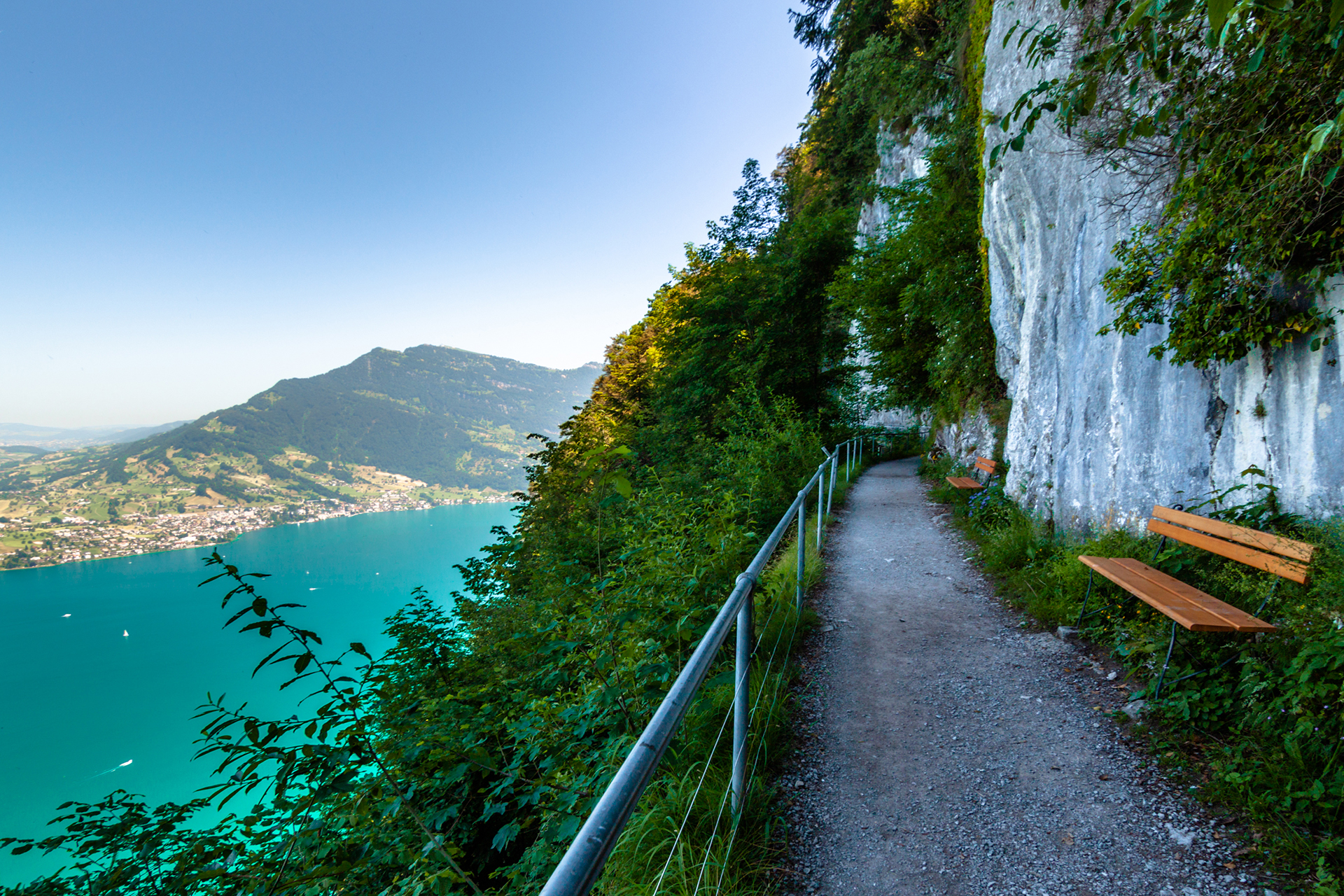 Cliff path on the Bürgenstock with panoramic views of Lake Lucerne and the surrounding mountains