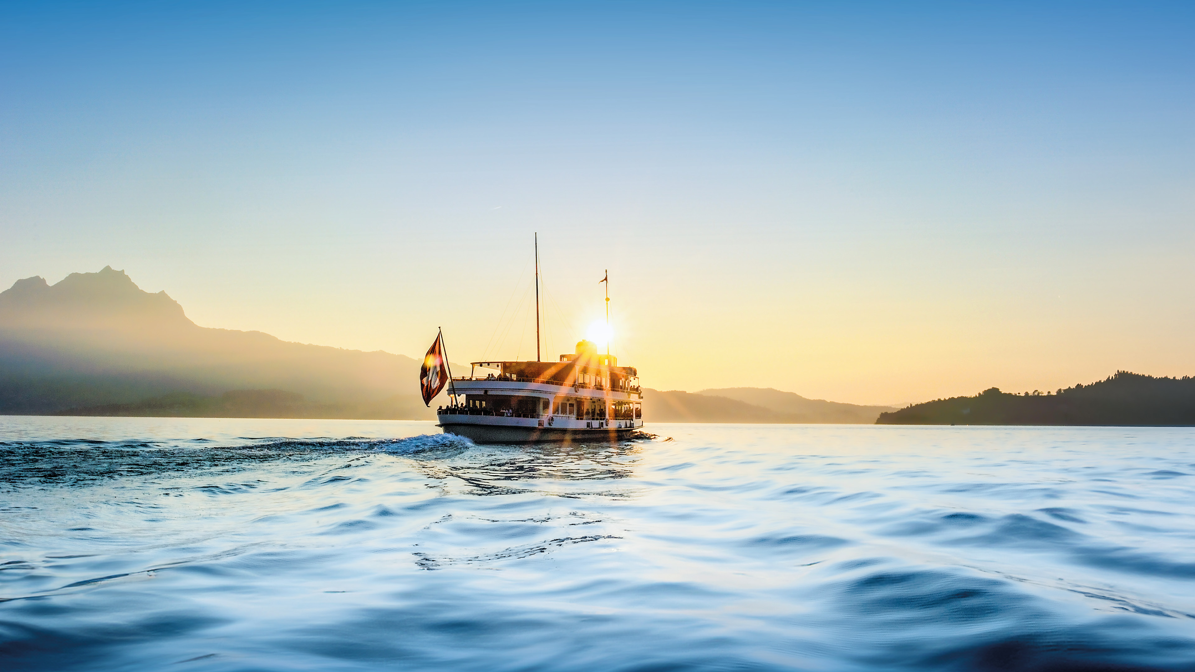 Keyvisual Campagne d'été Glück Ahoi - Voyage vers le bonheur sur le lac des Quatre-Cantons. 