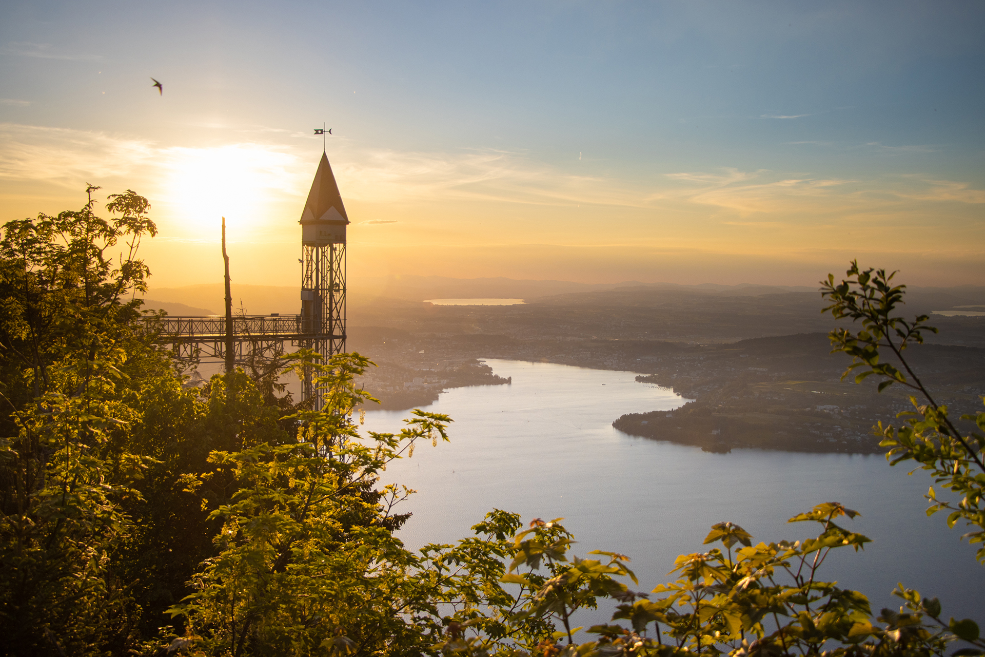 View from the Bürgenstock overlooking Lake Lucerne at sunset with the Hammetschwand Lift tower