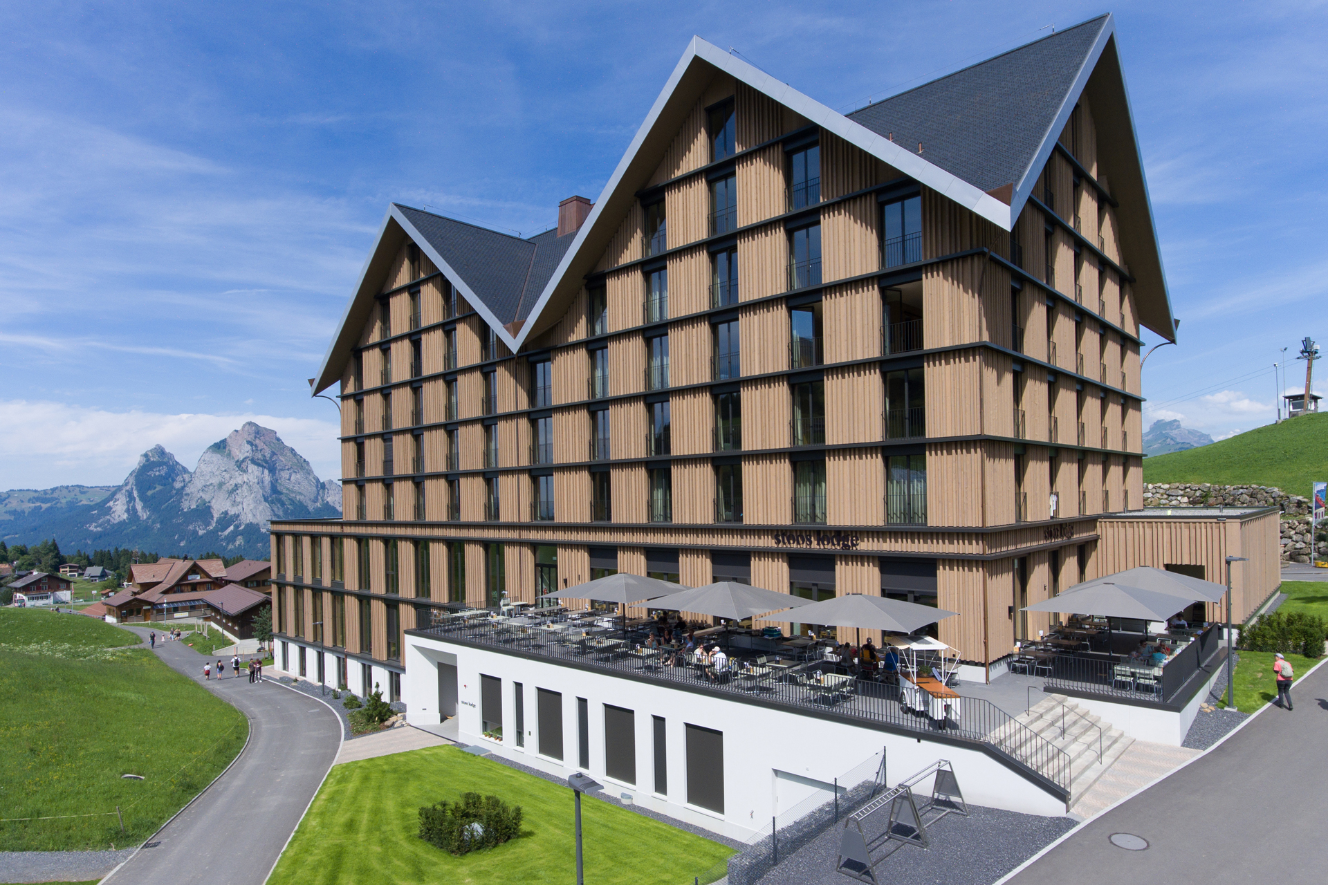 Hotel on Stoos next to the mountain station with modern timber architecture in an alpine setting.