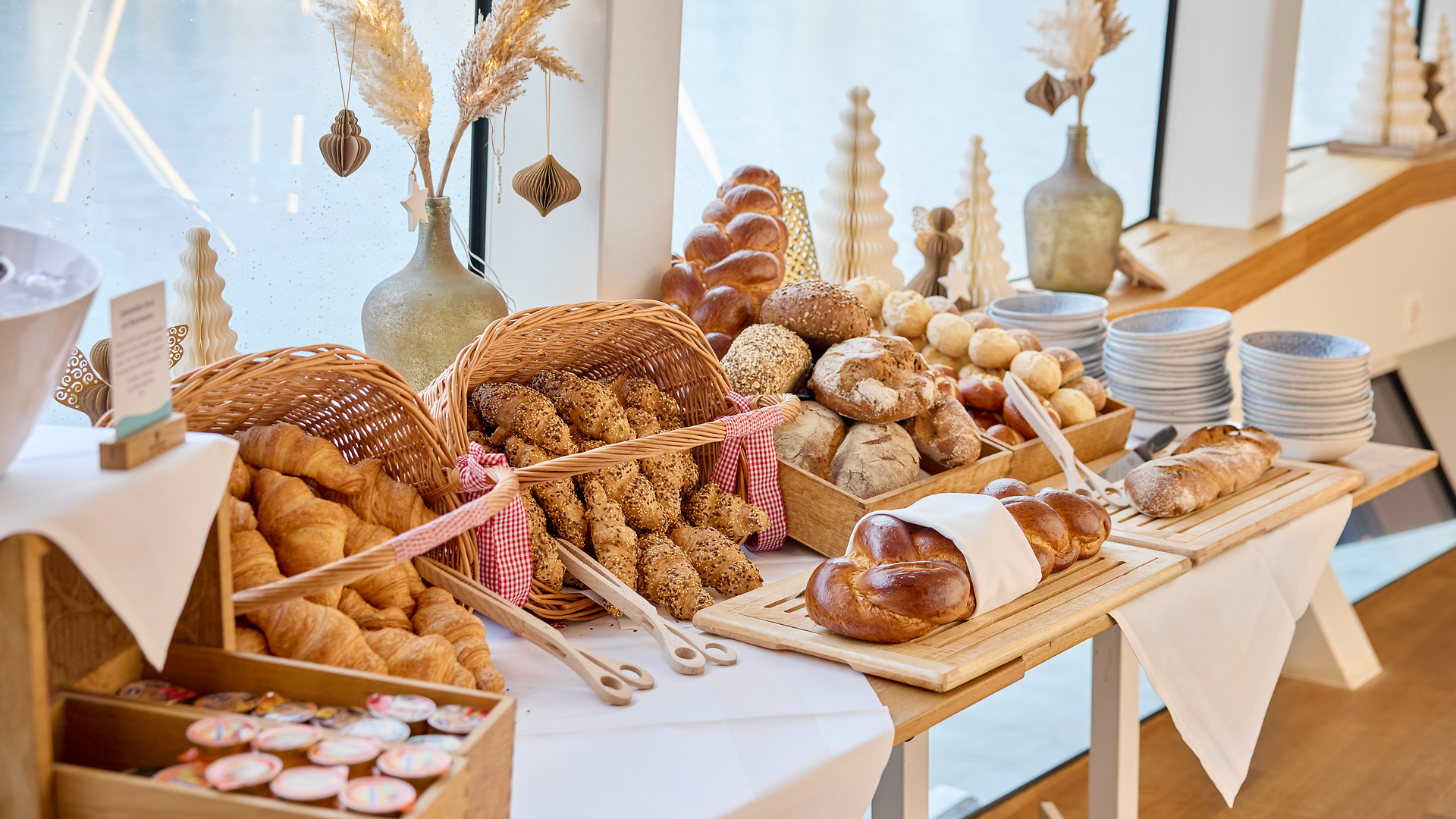 Brunch buffet on the ship with a variety of breads and pastries for a hearty Sunday breakfast.
