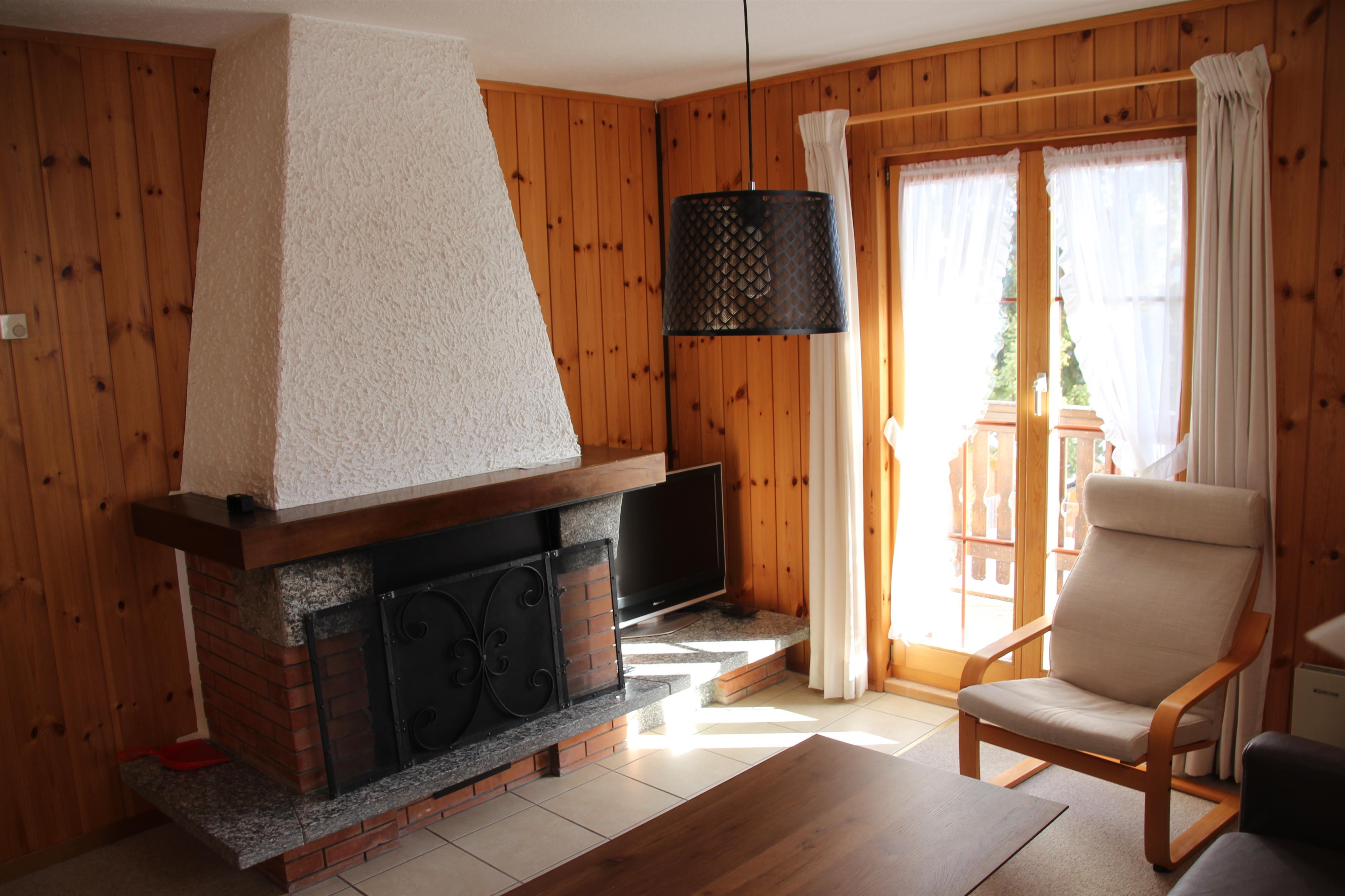 Coco EG Süd - Wohnzimmer Kamin