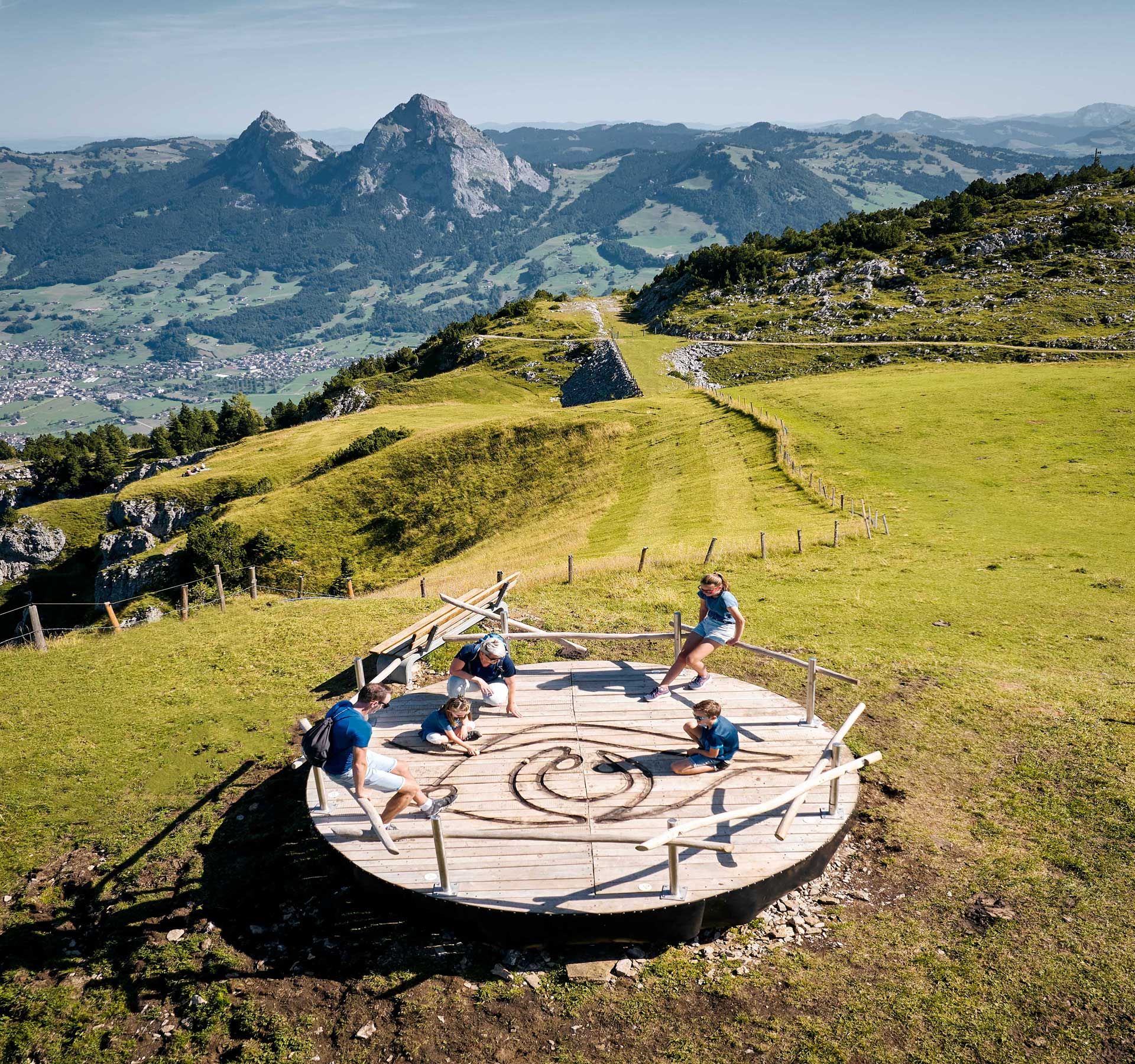 Aerial view of a family at a marble run on the Fronalpweg.