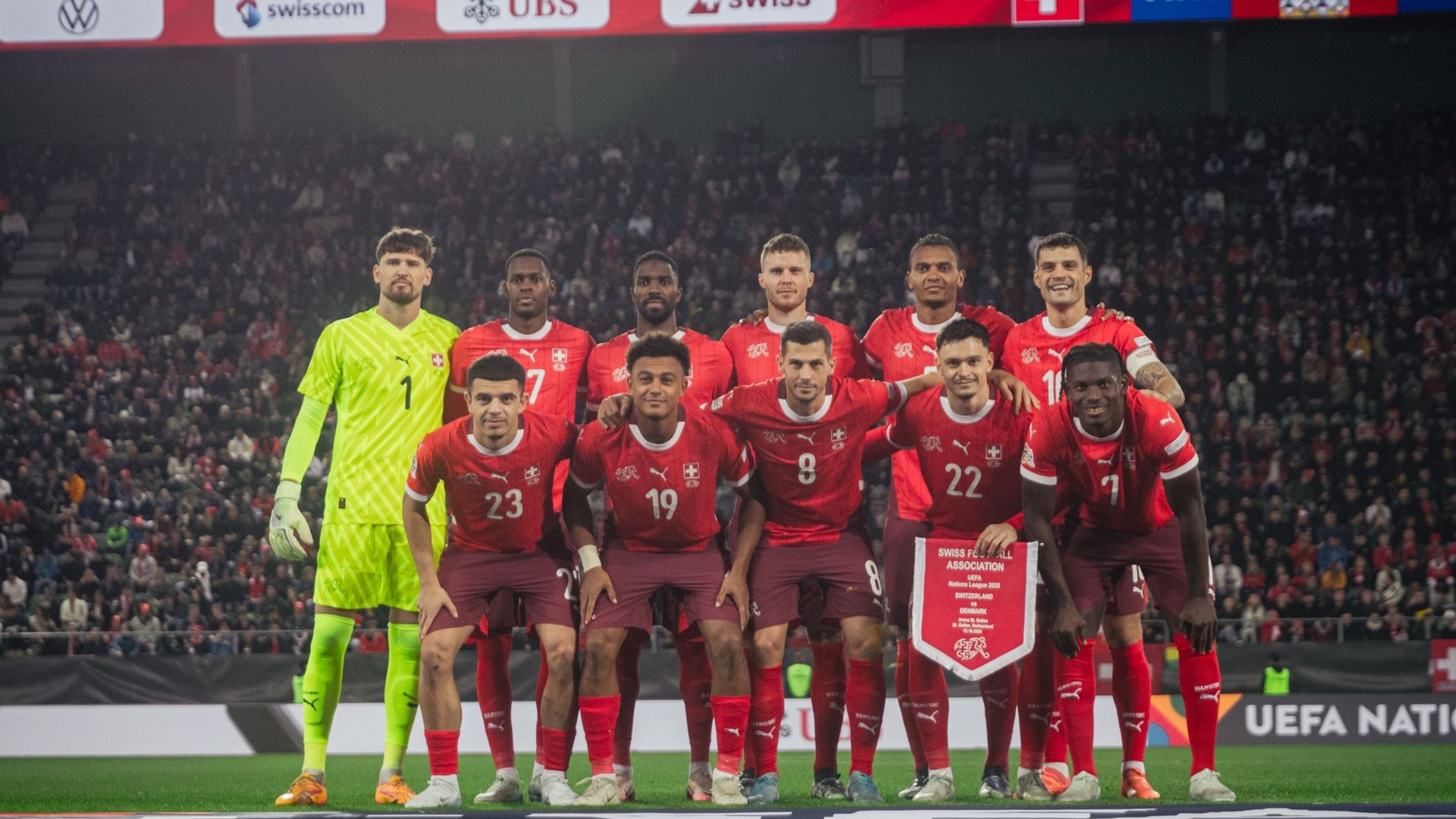 Group photo of the Swiss national football team posing together before the match.