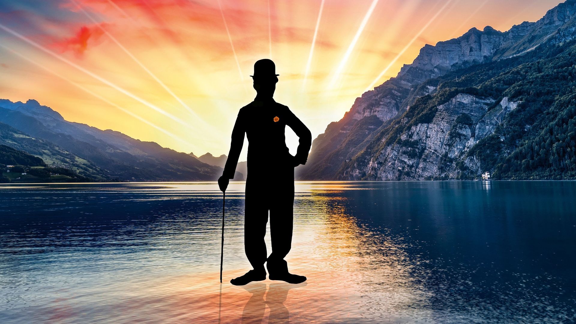 Walensee stage with the musical Chaplin – the musical set against the lake and mountain backdrop with an audience in front of the open-air stage.