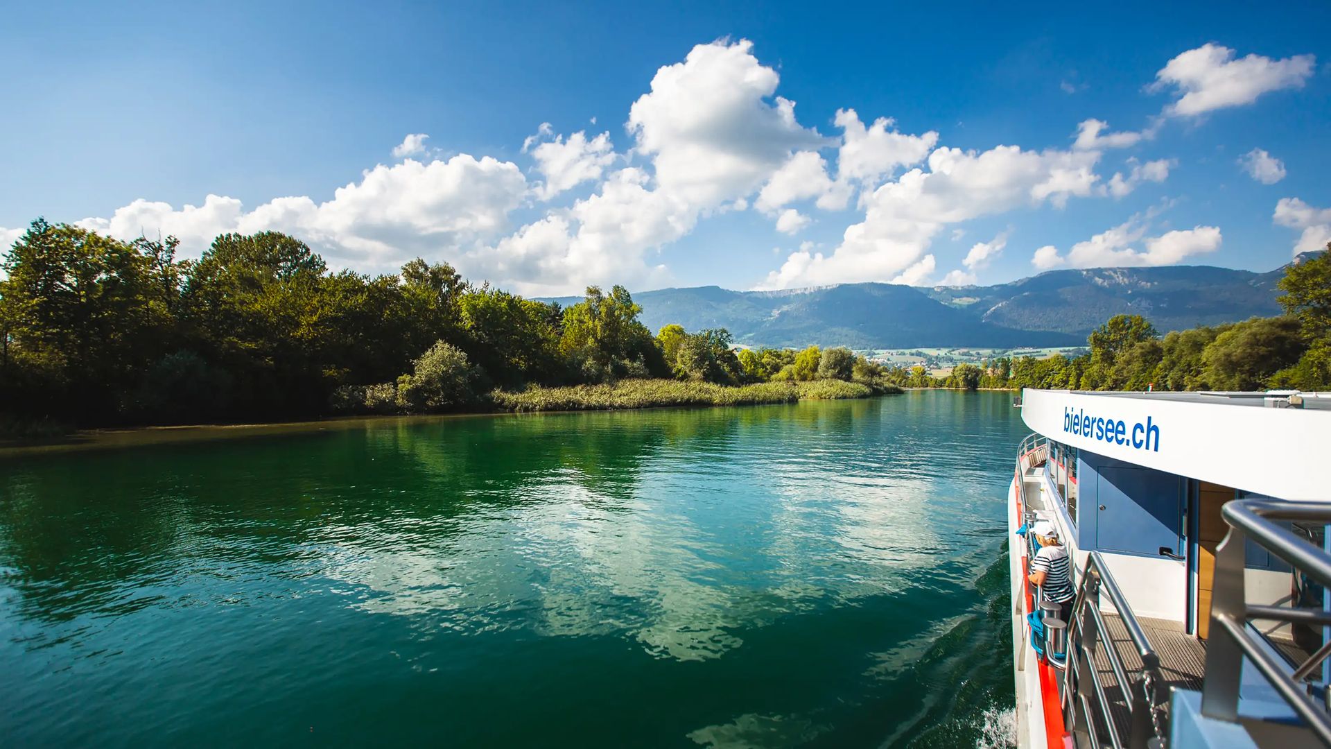 A boat on the river aare between trees