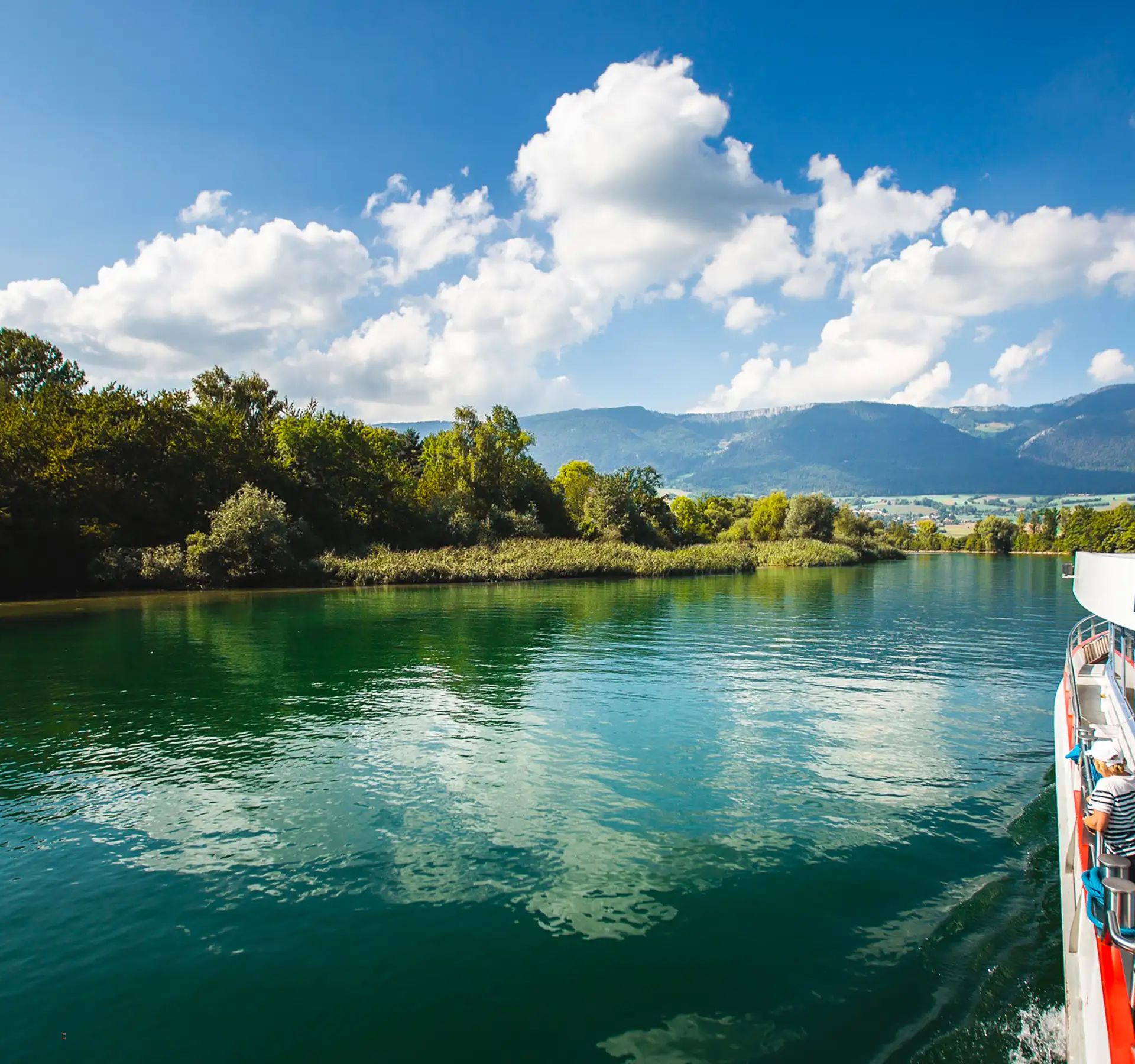 A boat on the river aare between trees