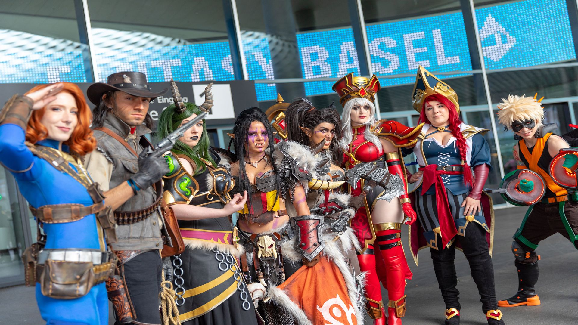 People gathered in front of the Messe Basel building for Fantasy Basel – The Swiss Comic Con, many dressed in cosplay.