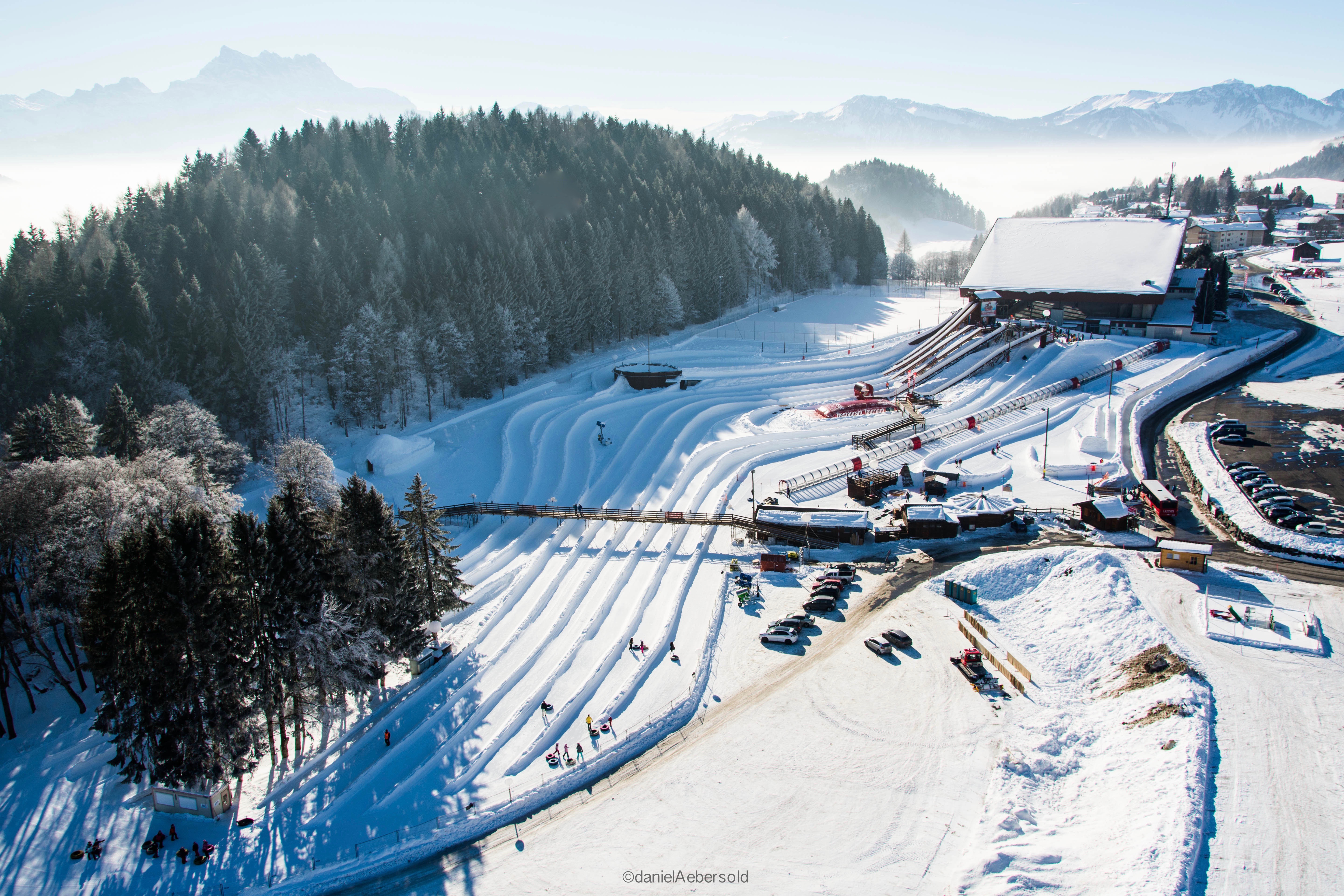 Aerial view of the Tobogganing Park in Leysin. You can see various slopes for sliding. 