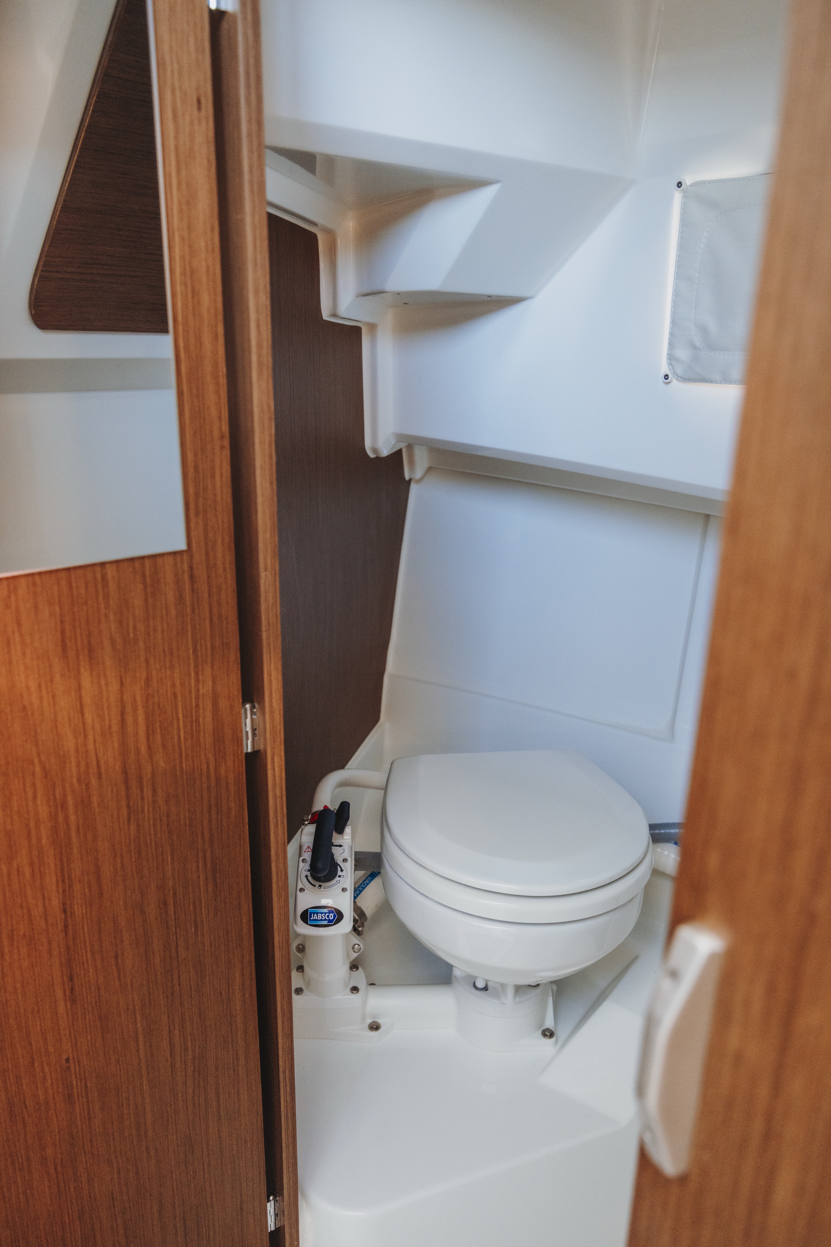 Private restroom on board the Jeanneau Merry Fisher 795 during a Lake Lucerne boat tour.