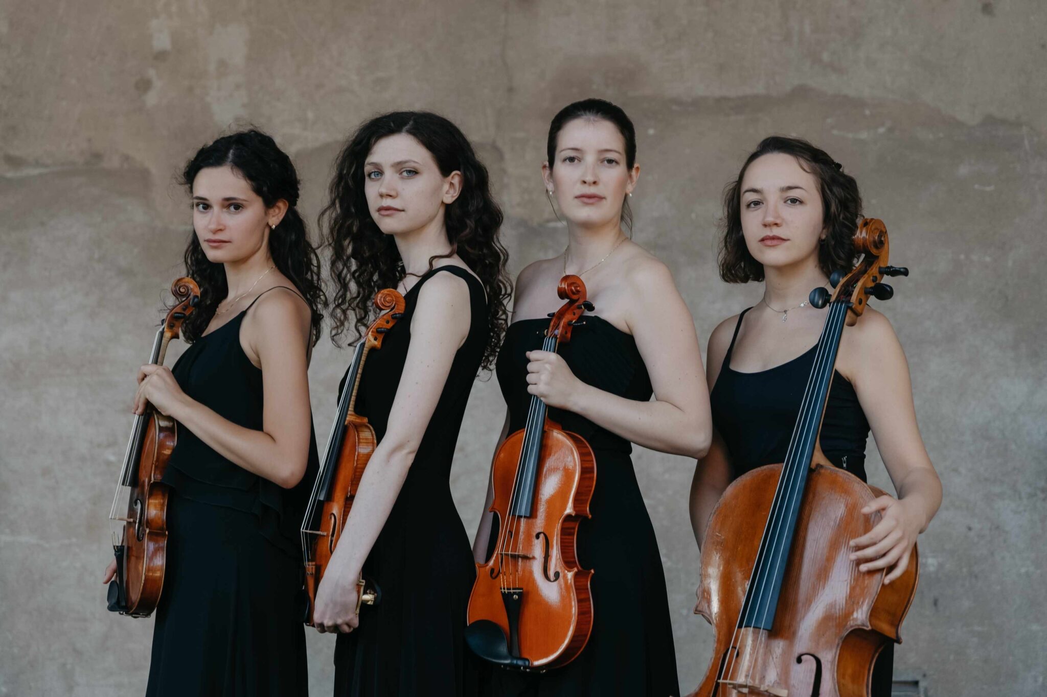 Four musicians lined up in a row