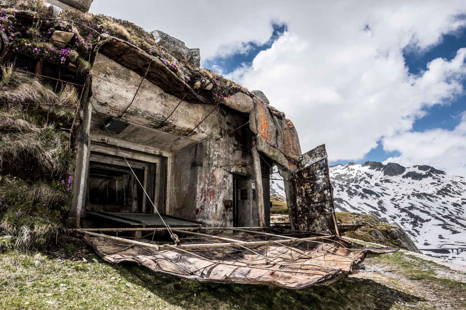 Outer bunker of the Gotthard Fortress Sasso San Gottardo – historic defense structure built into the rock of the Swiss Alps with views of snow-covered peaks.