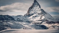 People snowshoing at the Gornergrat above Zermatt with the Matterhorn in the background