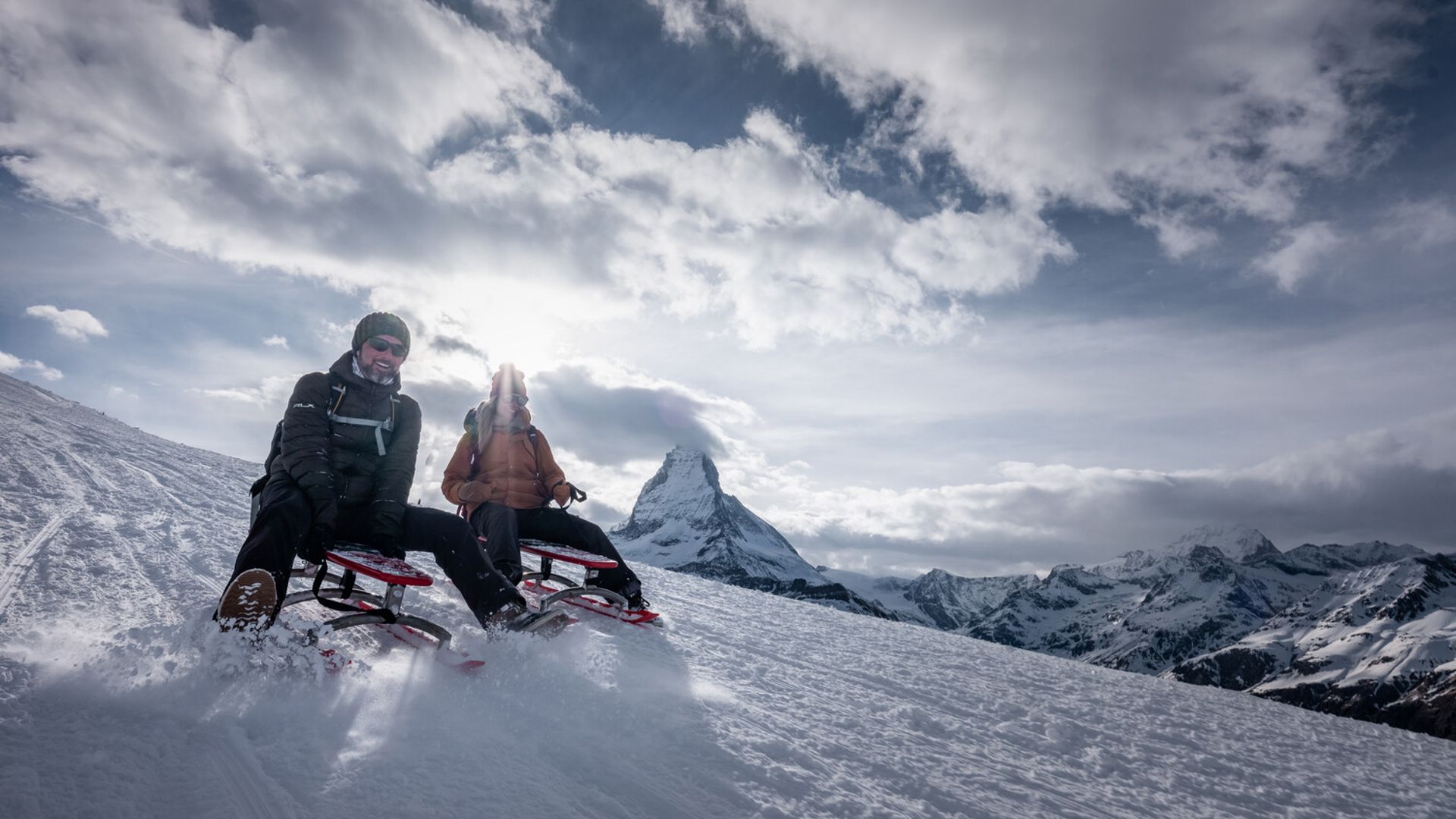 Couple sledging on the Gornergrat