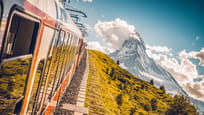 Train of the Gornergrat railway climbing up in autumn, Riffelberg, Zermatt