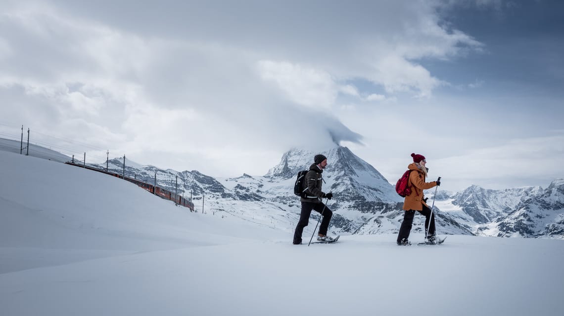 People snowshoeing from Rotenboden to Riffelberg in Winter, Zermatt, Switzerland